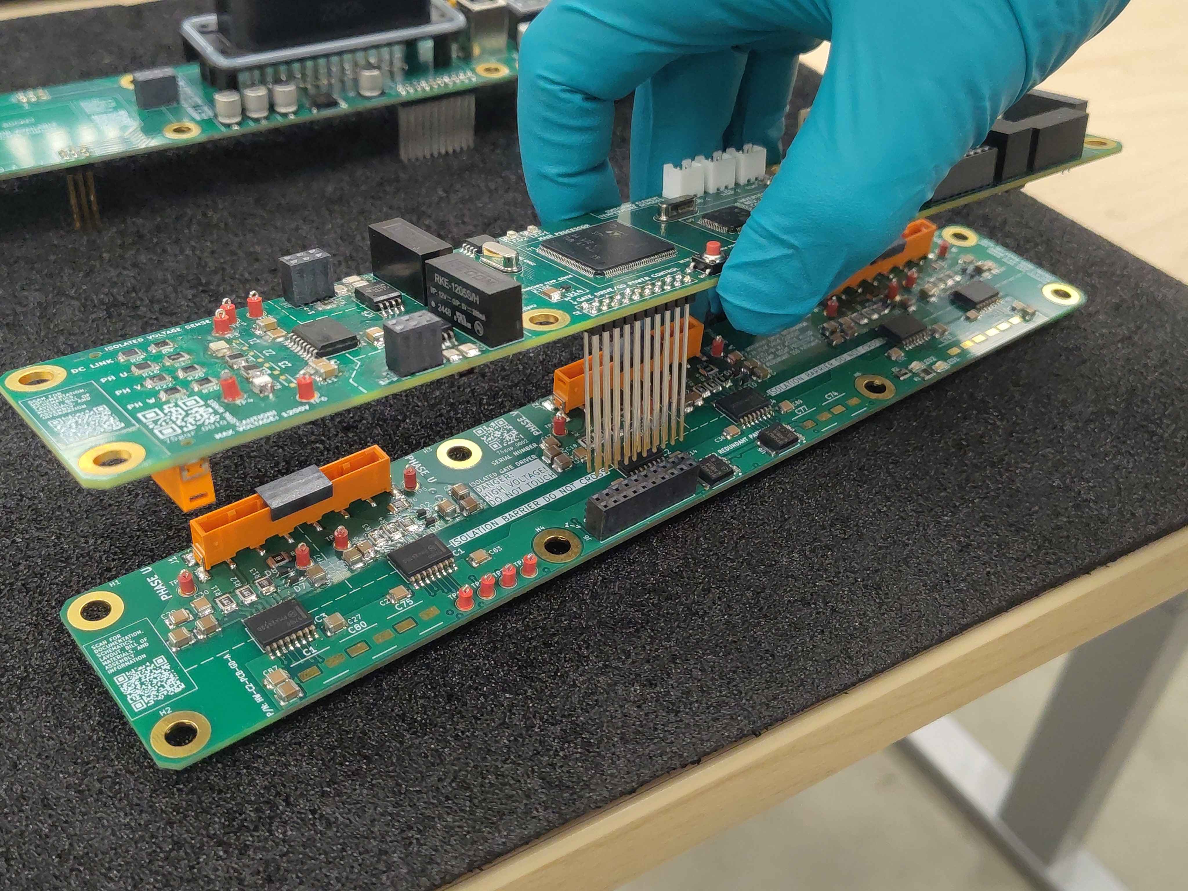 Lowering the control board onto the gate driver board