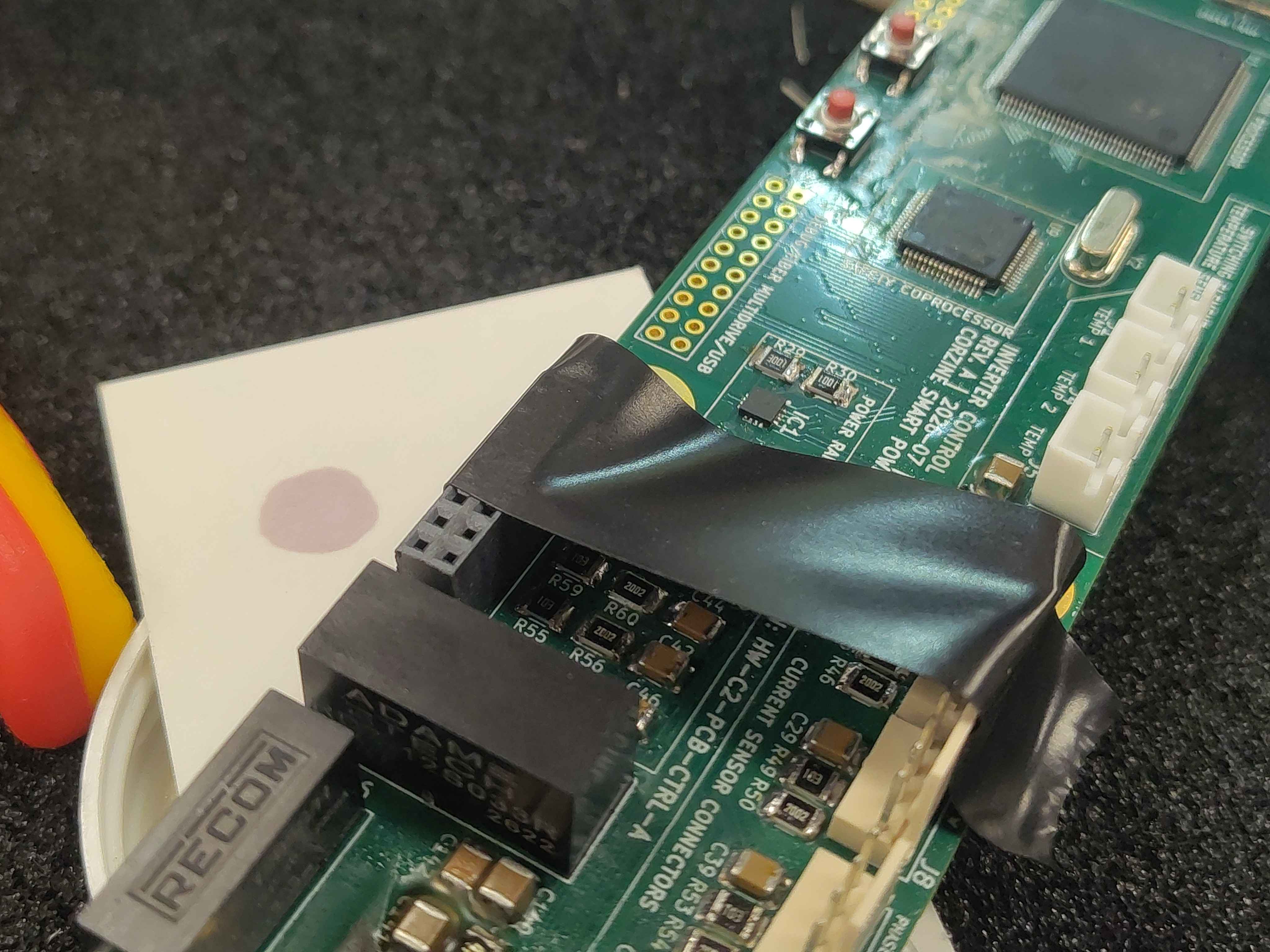 Using Kapton tape to hold a header flat against the board while soldering