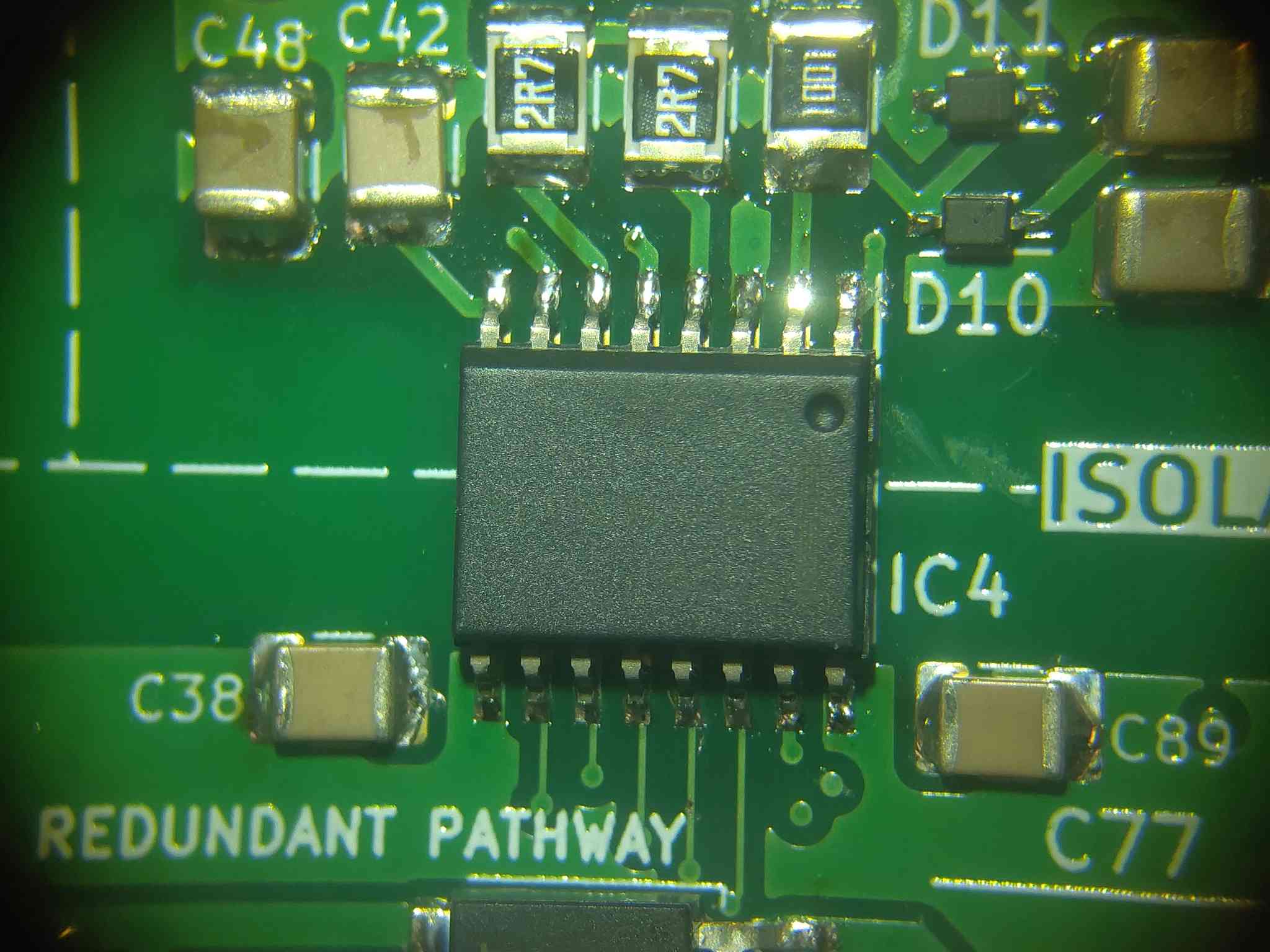 Gate driver board being soldered under a microscope
