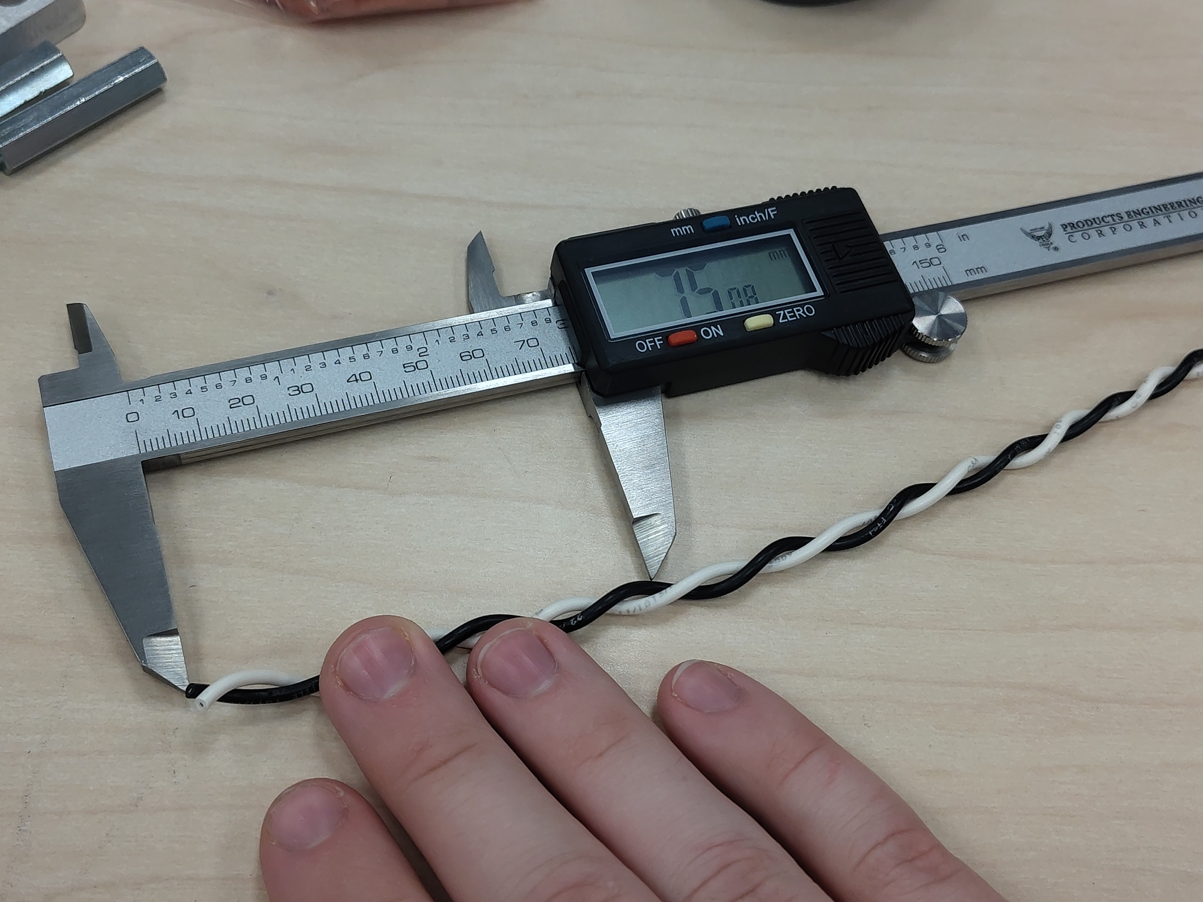 Measuring the strip length with calipers