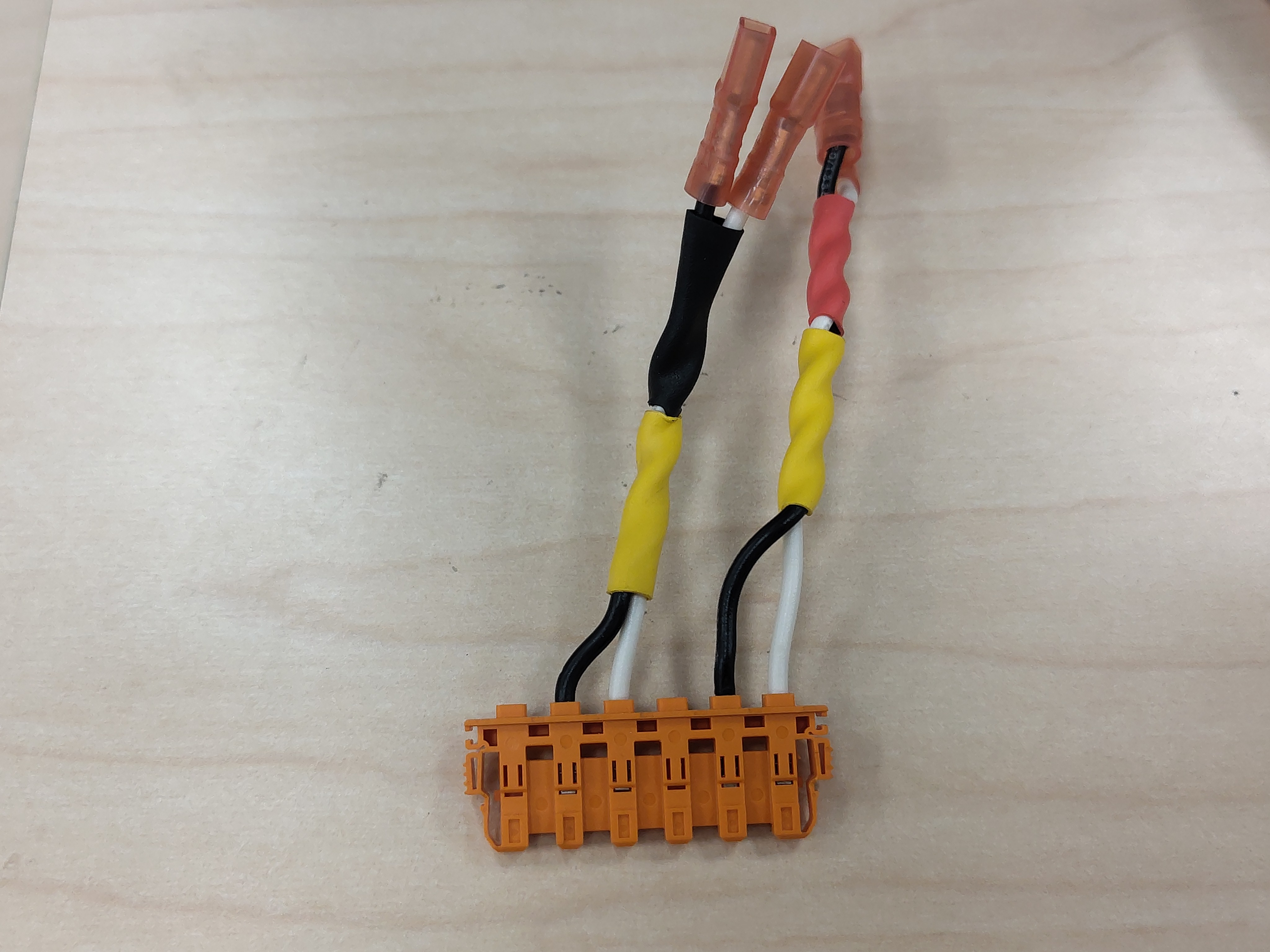 Phase-U pair terminals inserted into the orange housing