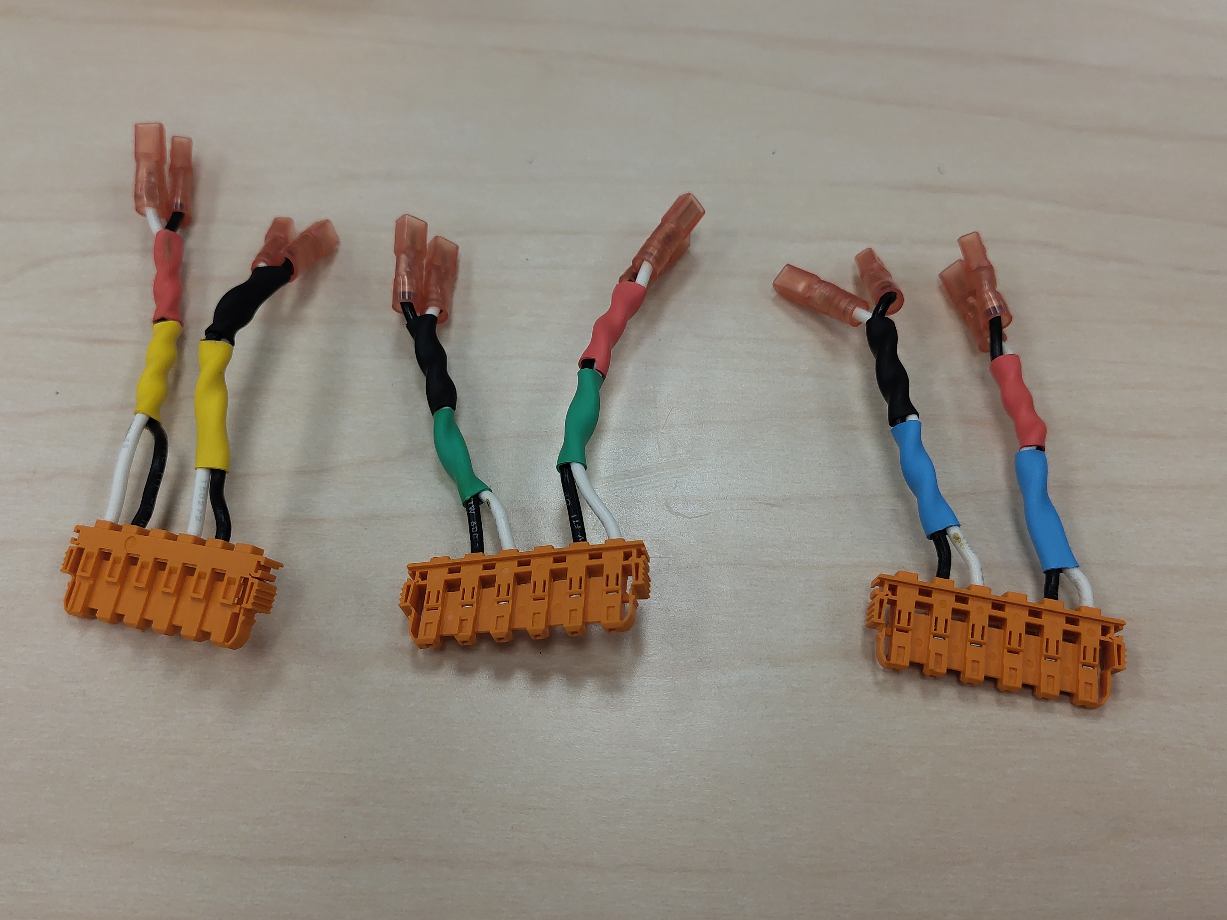 All three housings populated: U (yellow), V (green), and W (blue)