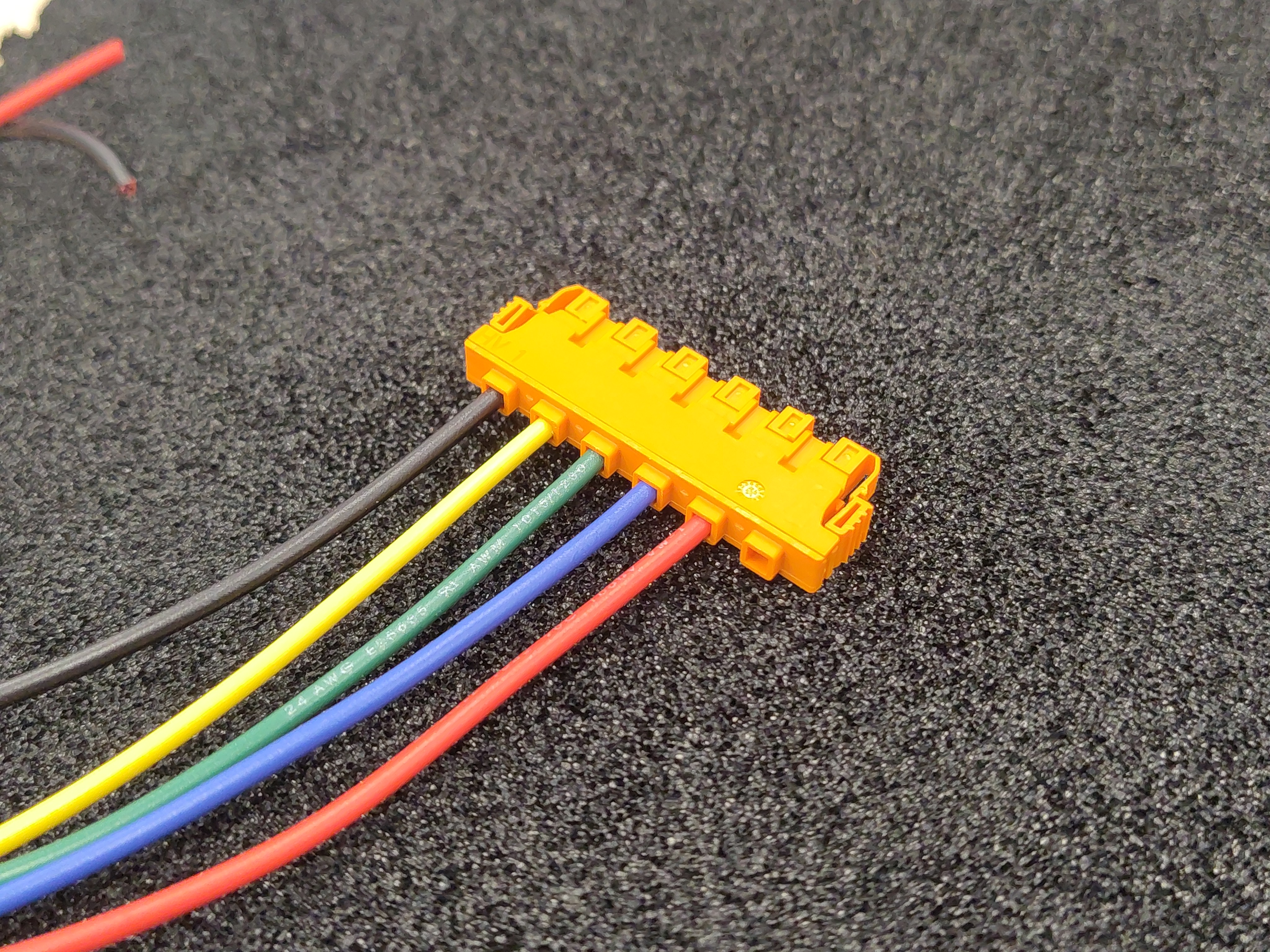 Populated voltage-sense housing, viewed from the wire side