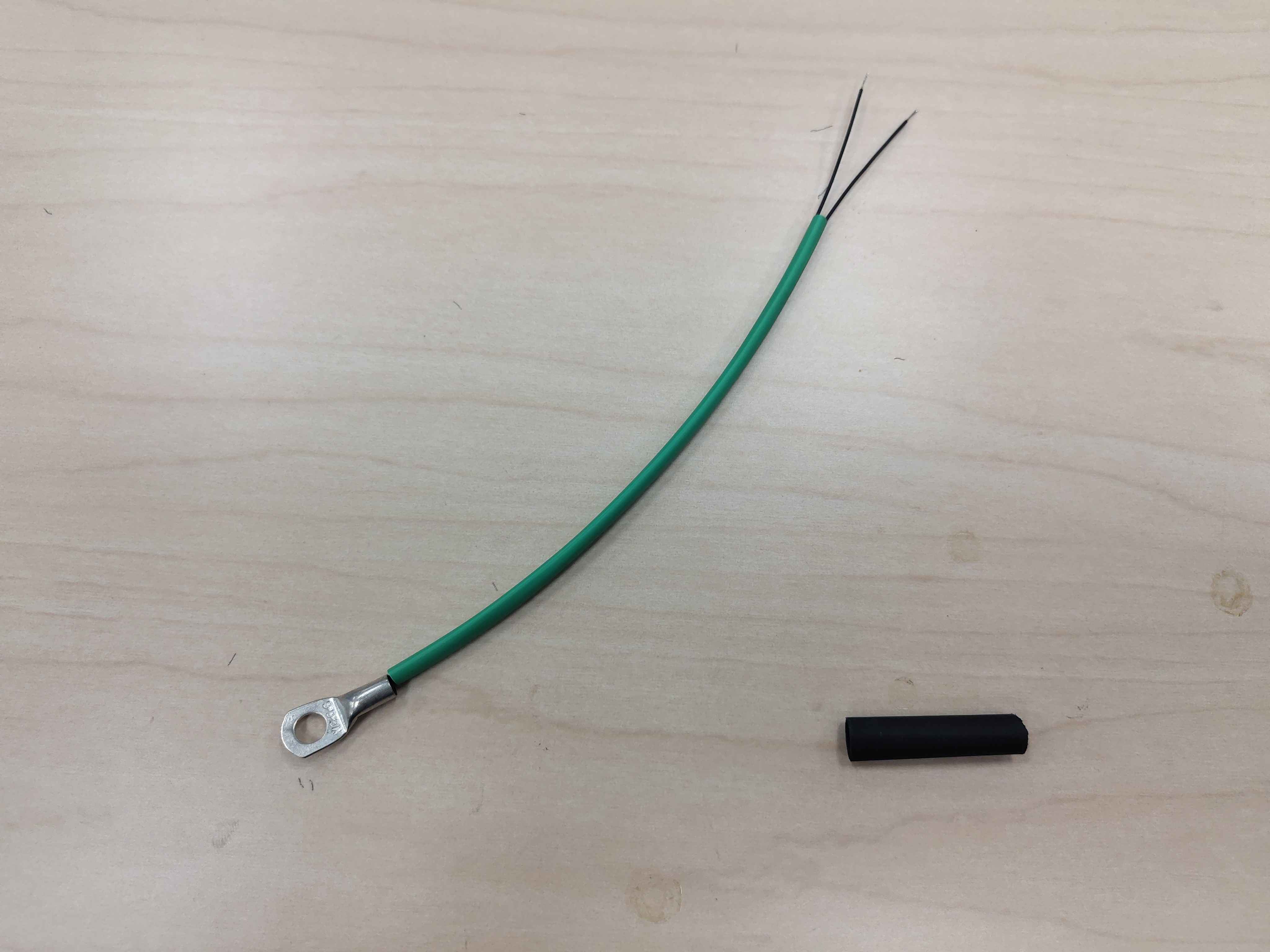 The long 1/8 in heat-shrink slid over the sensor lead