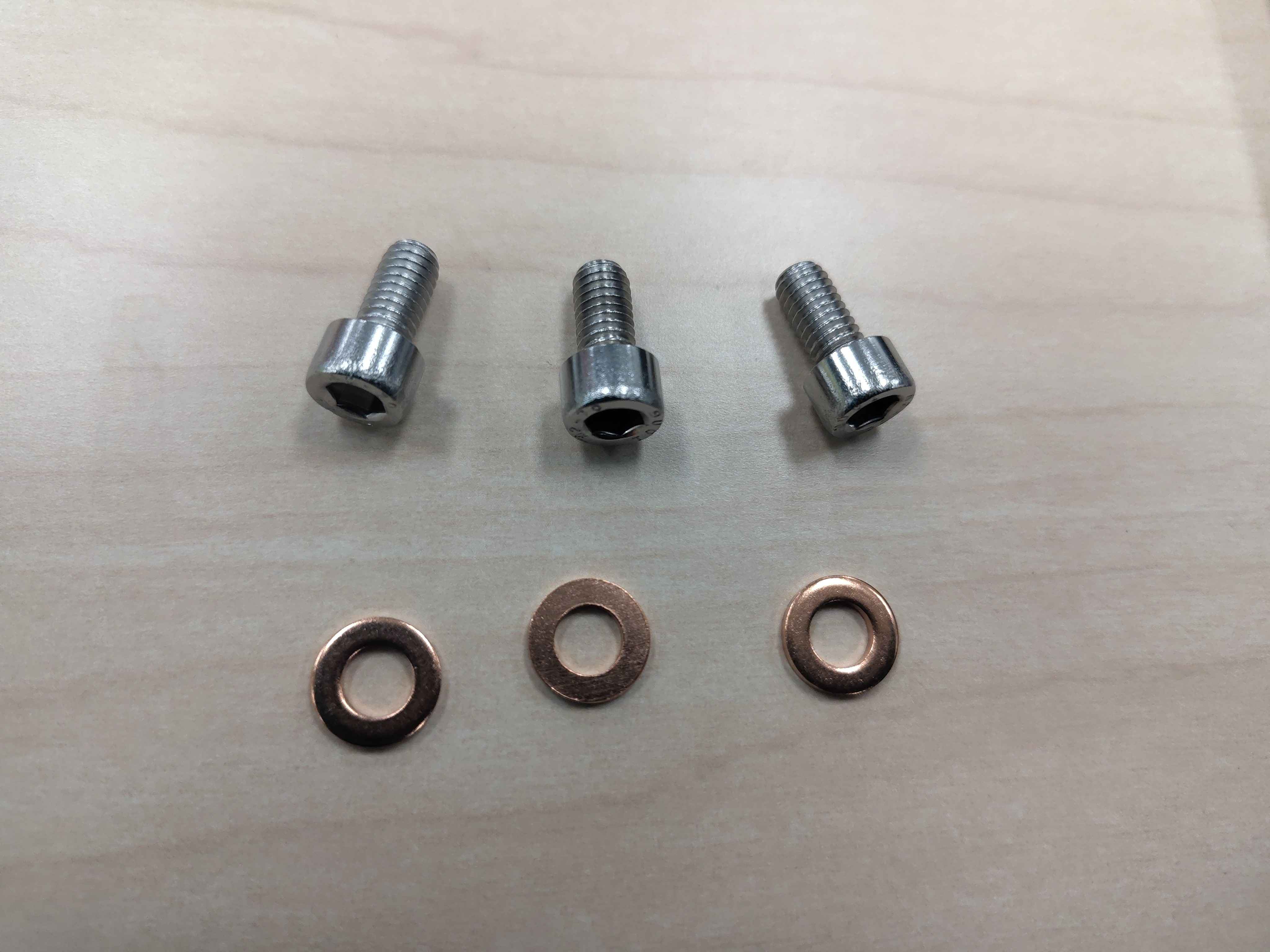 Screw, washer, and temperature-sensor hardware laid out