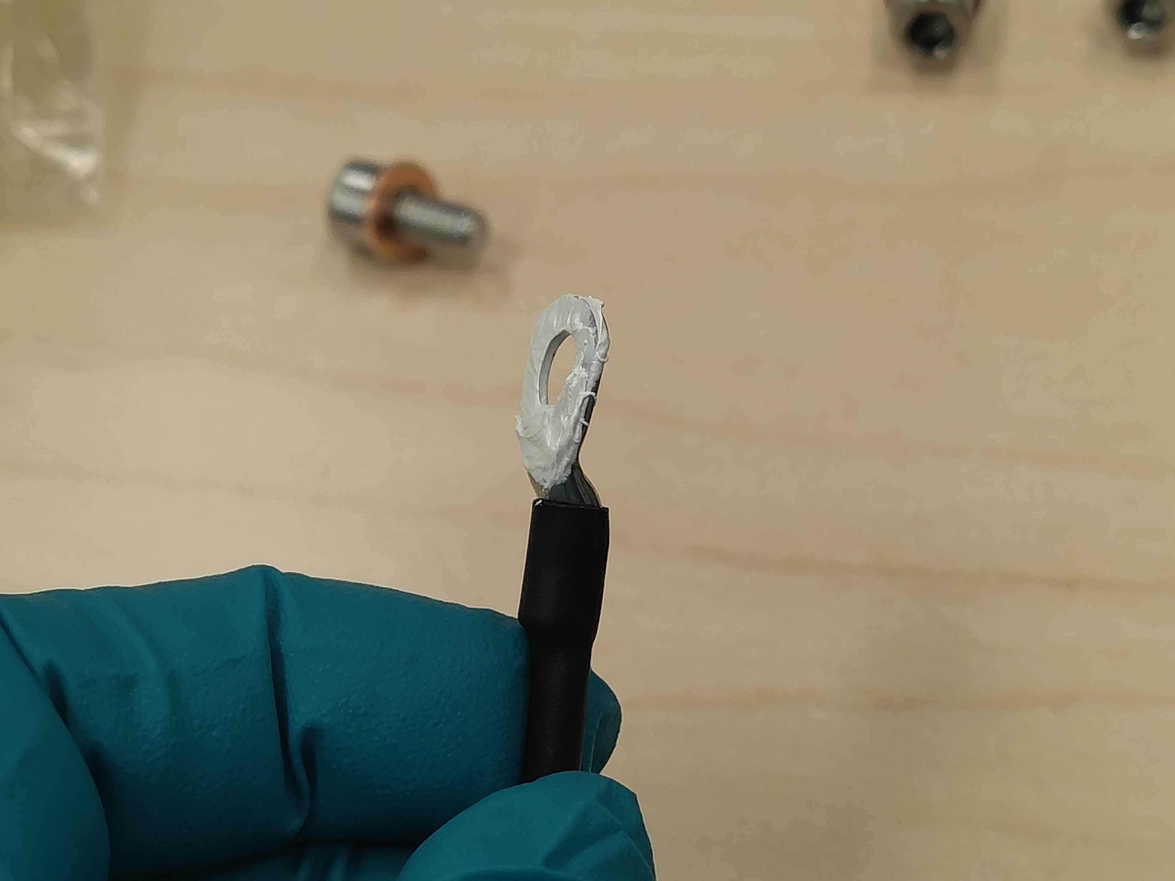 Thermal paste spread evenly across the lug contact surface