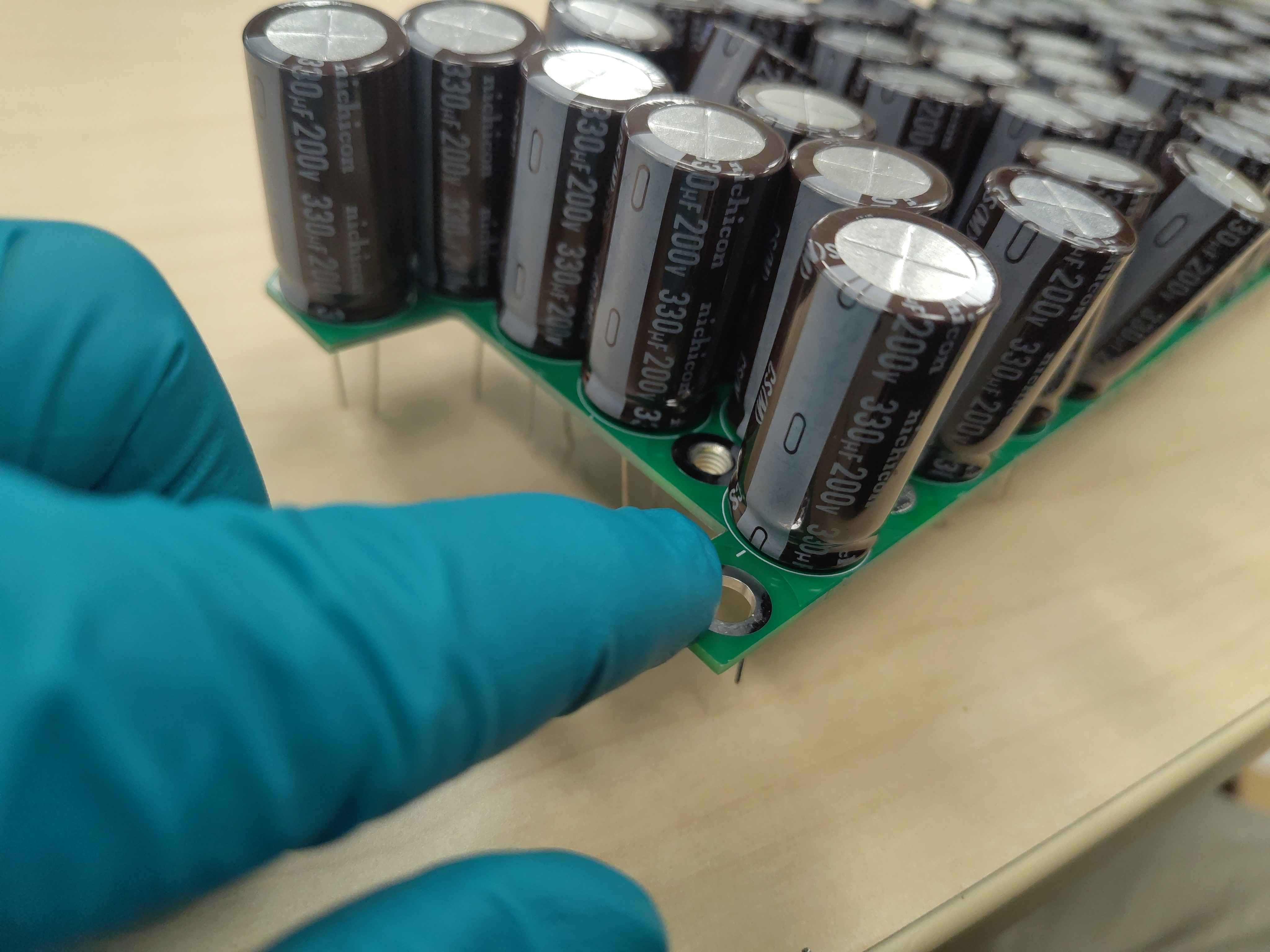 Checking capacitor polarity before inserting it into the PCB