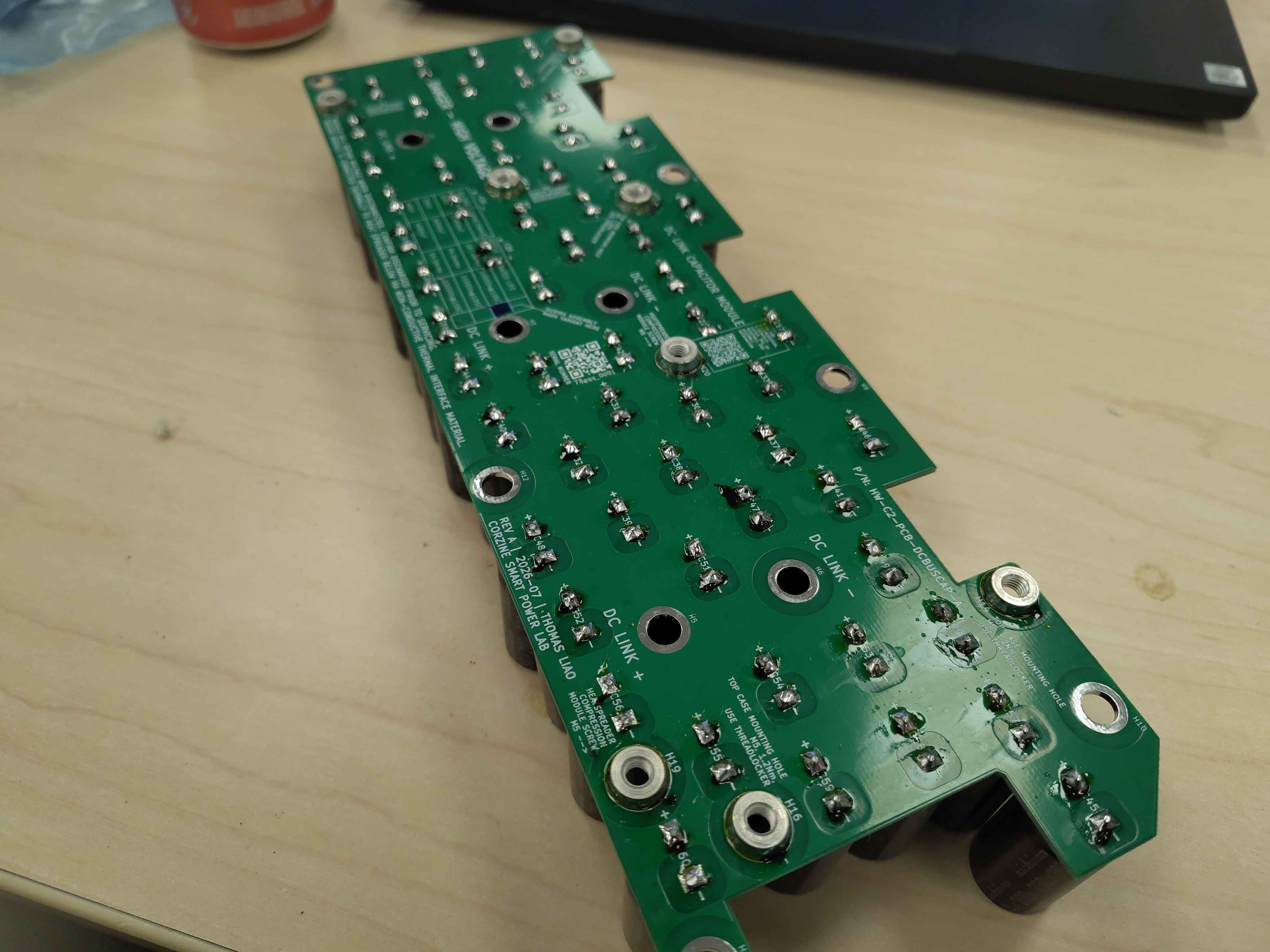 Close-up of the solder side showing completed joints and standoffs