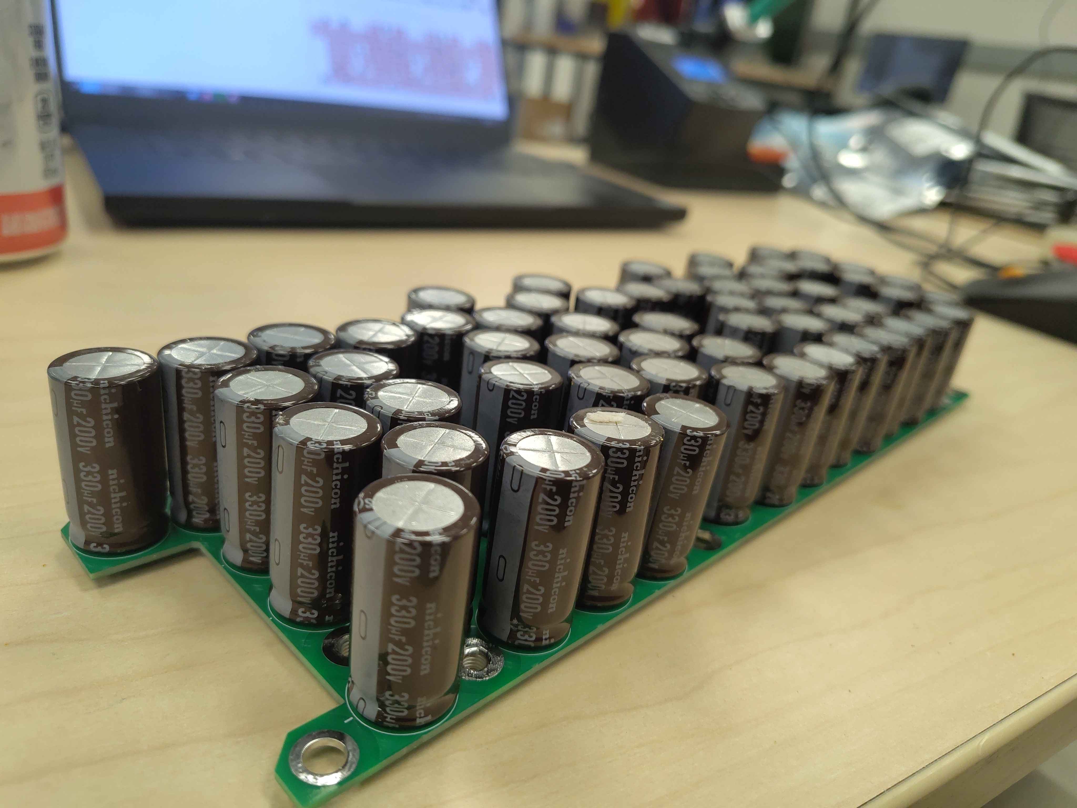 Angled view showing all capacitors standing upright and evenly spaced