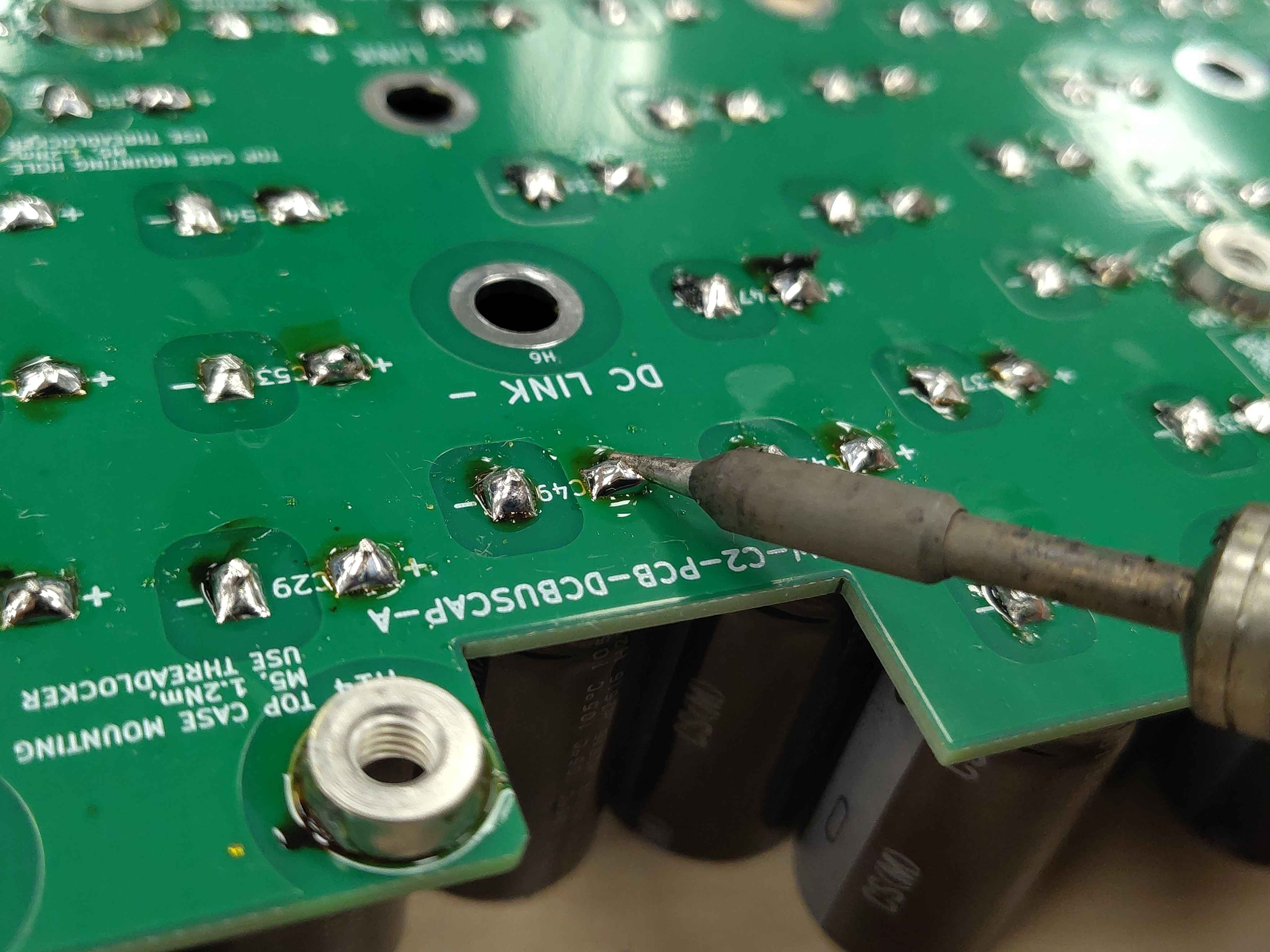 Reflowing a trimmed lead to heal any micro-fractures