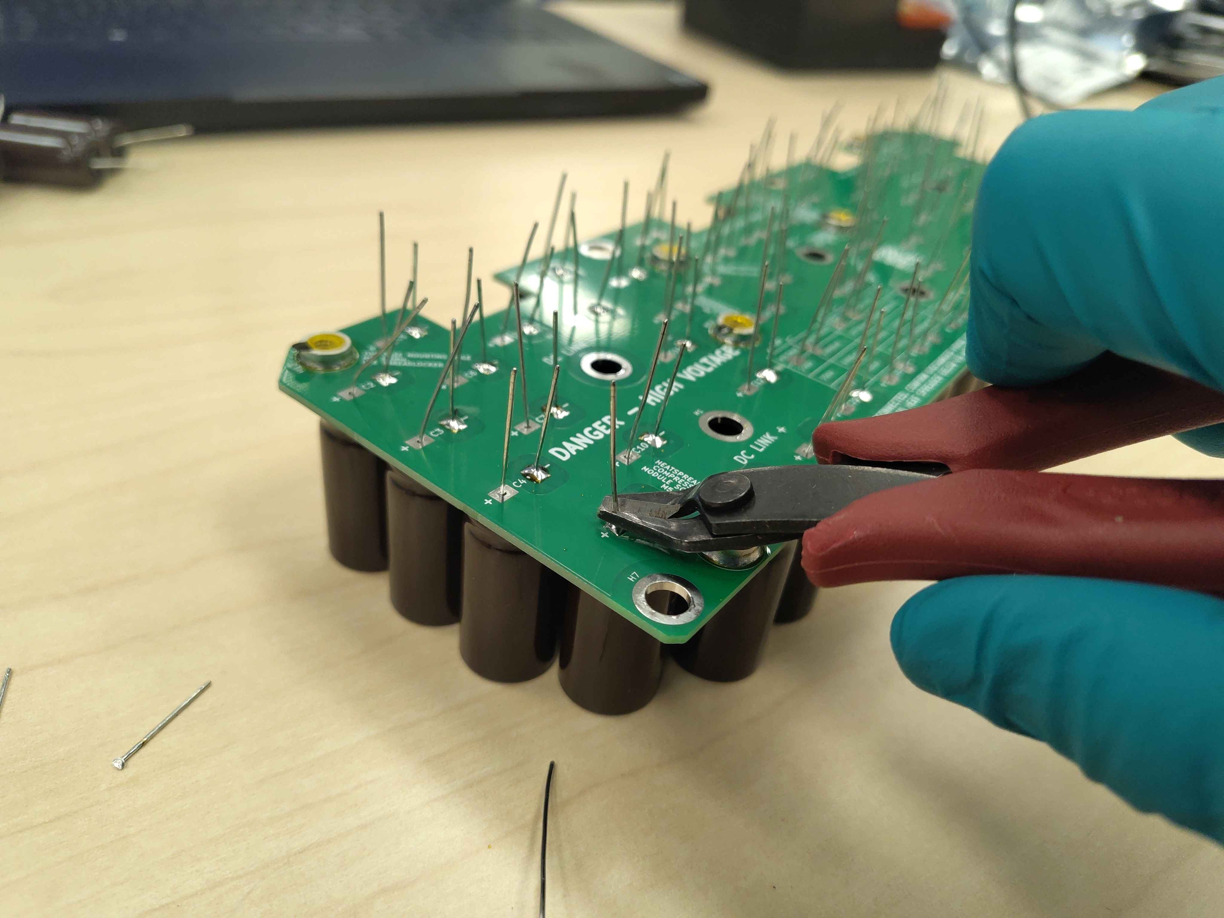 Trimming capacitor leads flush with the solder joint