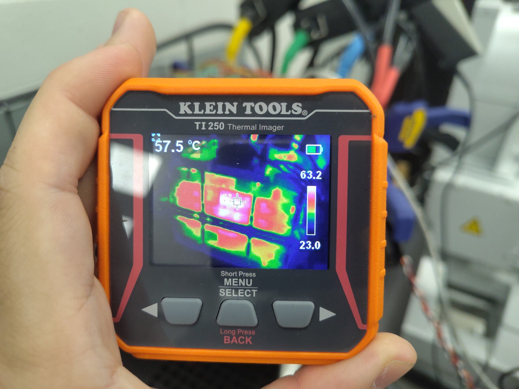 TI250 thermal view 2 (crosshair 57.5 °C, spot max 63.2 °C)